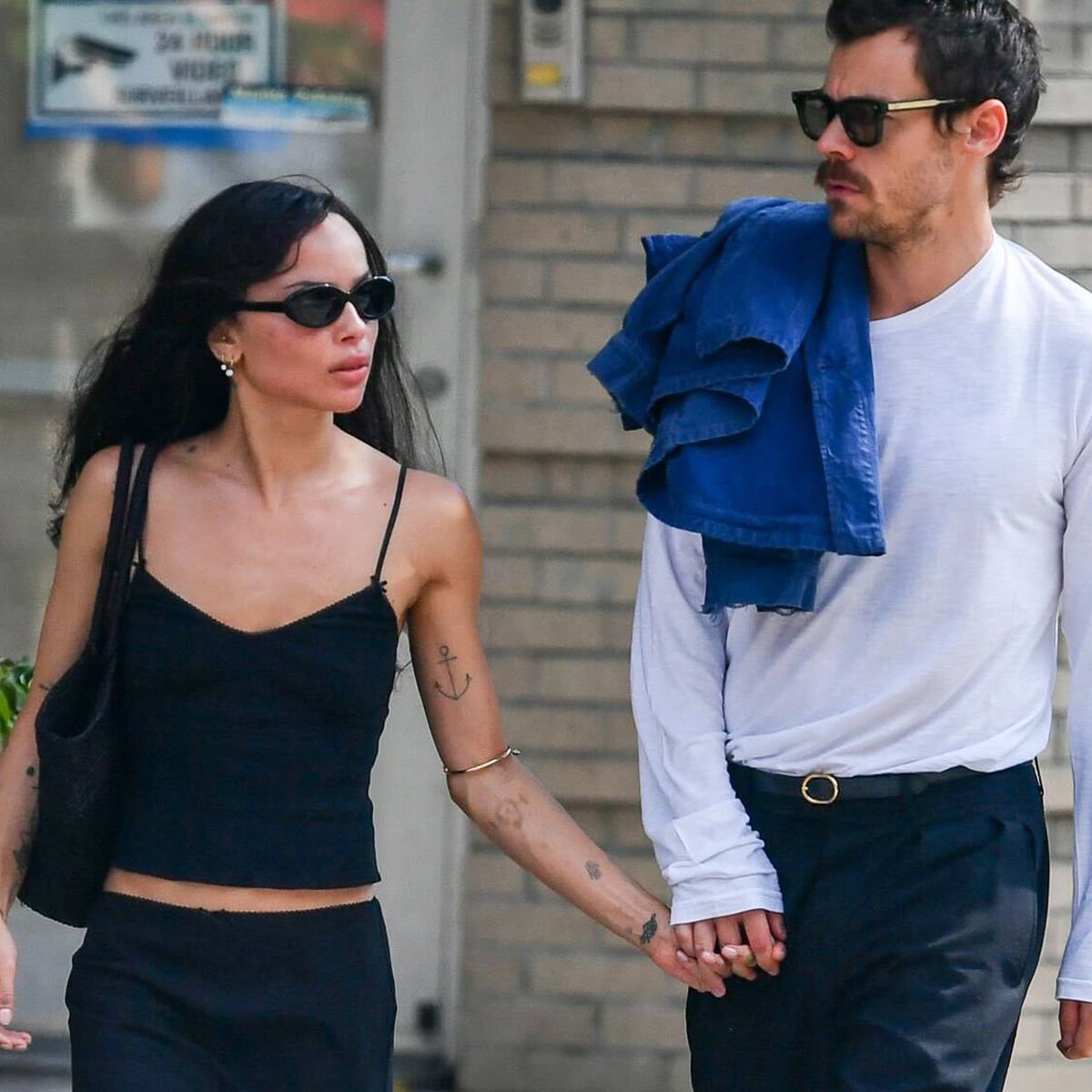 Zoe Kravitz and Harry Styles walking in New York City. Zoe is wearing a Cou Cou Intimates camisole and black knee-length skirt. 
