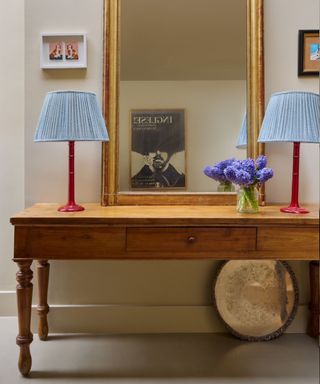 modified Georgian wooden table in a hallway with red table lamps