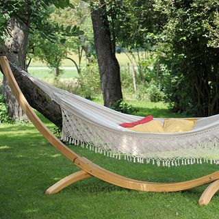garden area with hammock and cushions