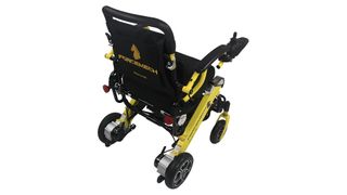 The ForceMech Voyager R2 photographed from the back, to show the wheelchair with the ForceMech logo printed in yellow
