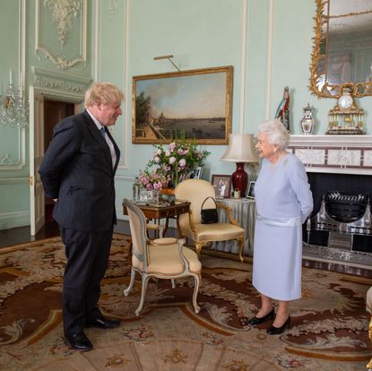 london, england june 23 queen elizabeth ii greets prime minister boris johnson during the first in person weekly audience with the prime minister since the start of the coronavirus pandemic at buckingham palace on june 23, 2021 in london, england photo by dominic lipinski wpa poolgetty images