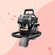 Bissell SpotClean HydroSteam on a pink background