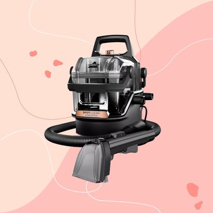 Bissell SpotClean HydroSteam on a pink background