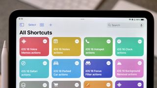 Photo of the Shortcuts app open on an iPad showing colorful icons corresponding the apps listed in the article.