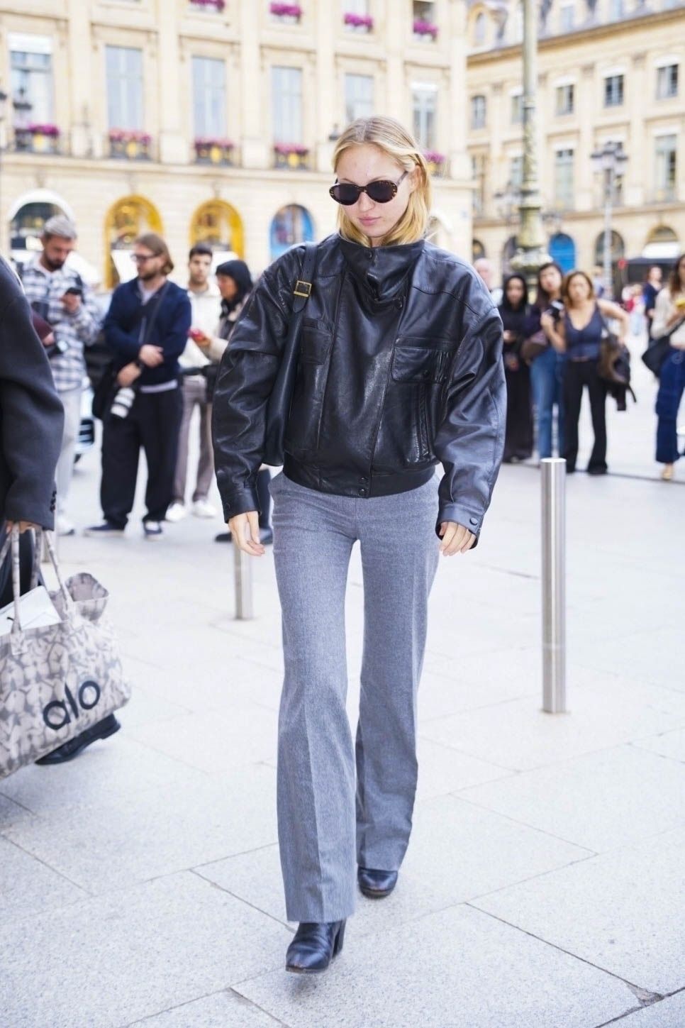 Fashion person Lila Moss wears the funnel neck leather jacket trend