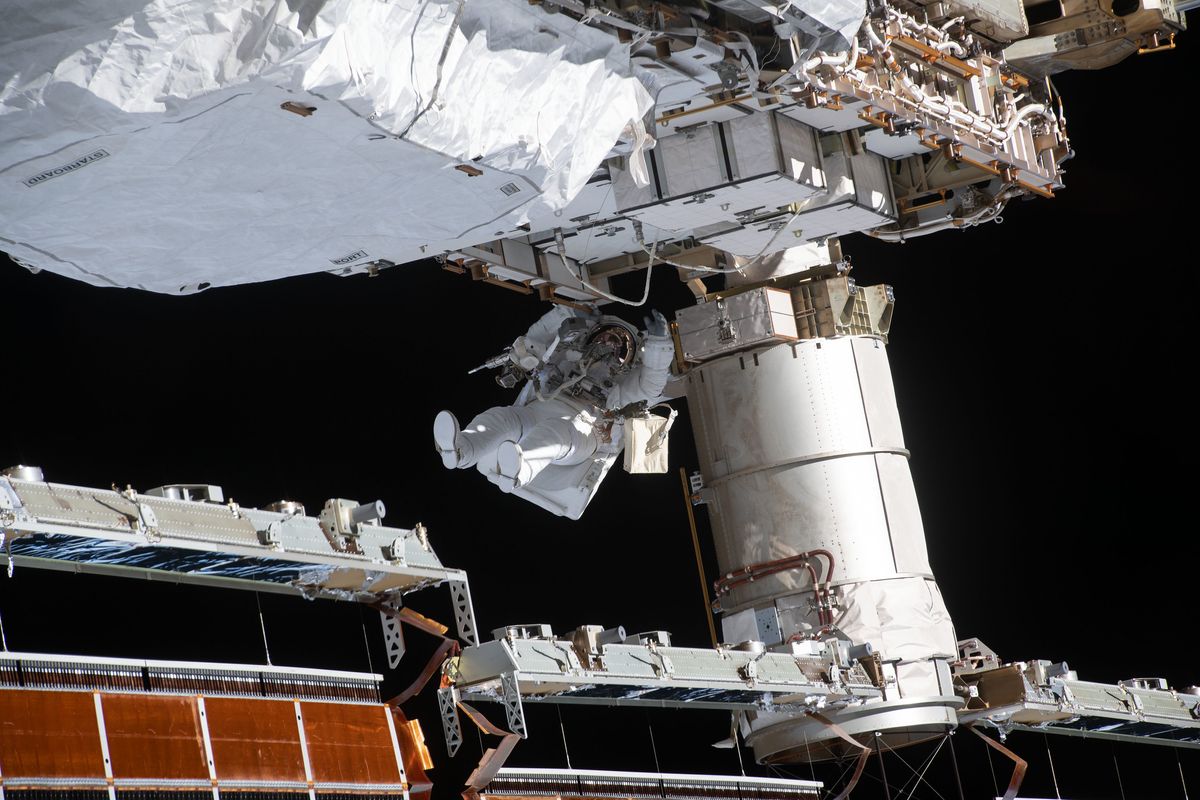 NASA astronaut Victor Glover works to ready the International Space station's port-side truss structure for future solar array upgrades during a spacewalk on Jan. 27, 2021.