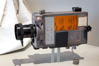An Apollo 11 Data Acquisition Camera is reunited with its 16mm film magazine as last used together aboard the lunar module Eagle in the new "50 Years from Tranquility Base" exhibit.