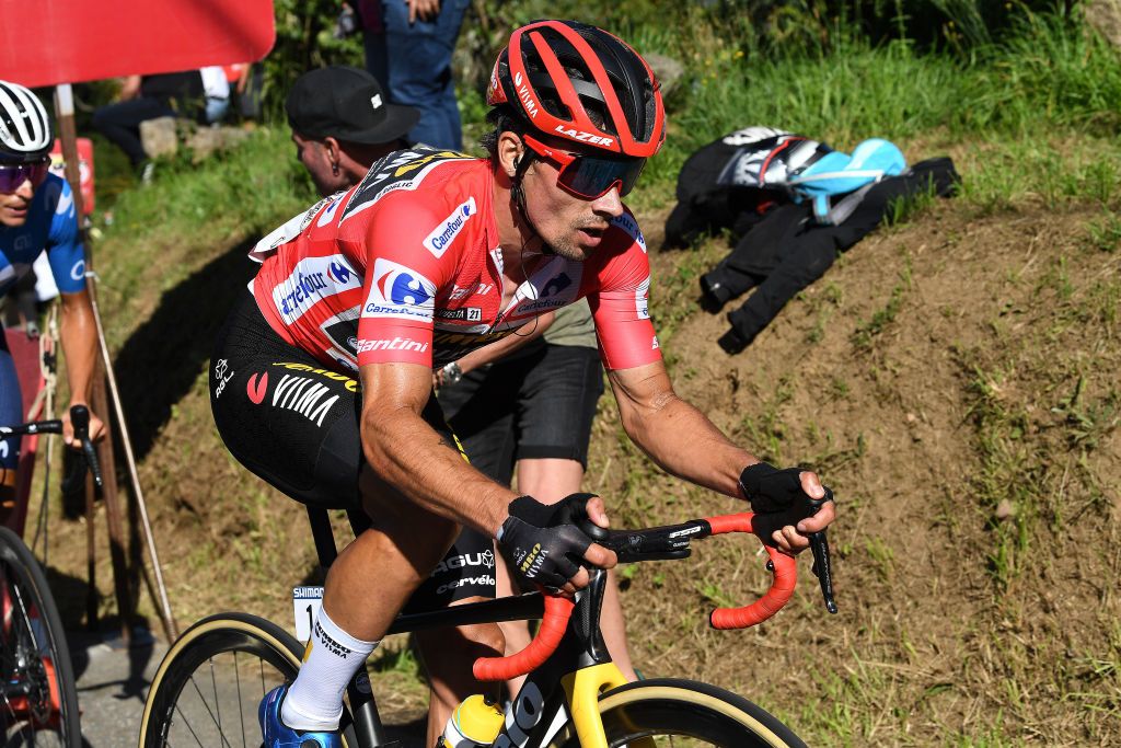 MOS SPAIN SEPTEMBER 04 Primoz Roglic of Slovenia and Team Jumbo Visma red leader jersey competes in the chase group during the 76th Tour of Spain 2021 Stage 20 a 2022km km stage from Sanxenxo to Mos Alto Castro de Herville 502m lavuelta LaVuelta21 on September 04 2021 in Mos Spain Photo by Tim de WaeleGetty Images