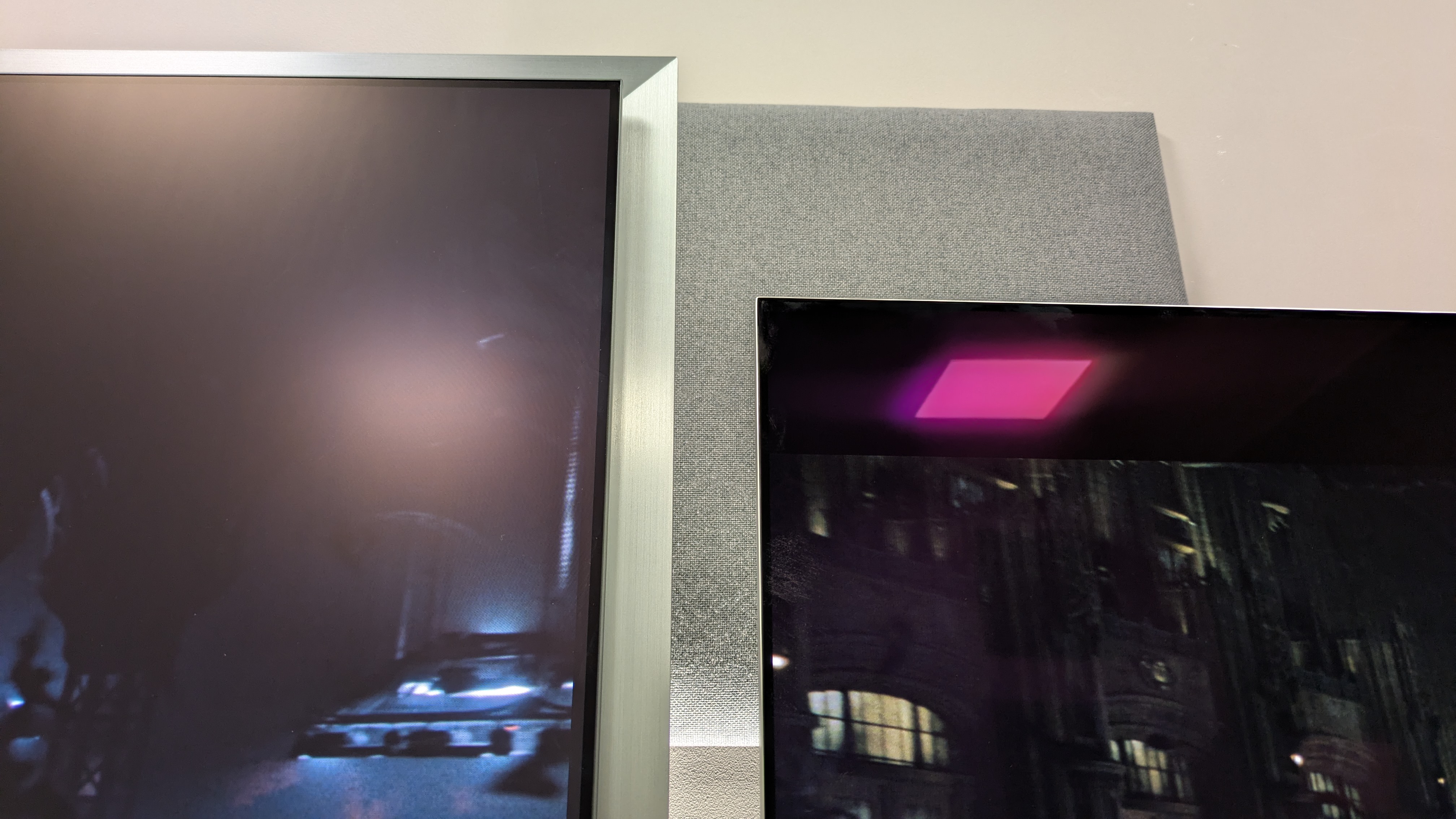 Samsung S99H (left) vs LG G6 (right) showing a light reflected in each TV's screen. The S99H has reduced the light to a haze, whereas it's clearer on the G6