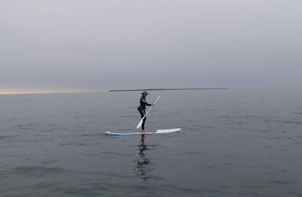 Mary McConneloug paddles past No Man's Island