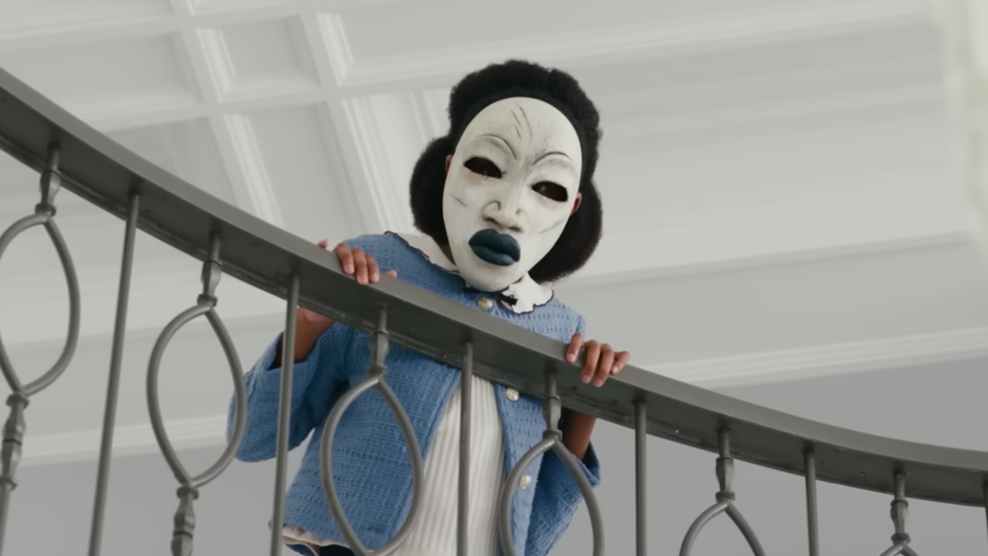 Romy Woods wears a mask as Zuri in Strung.