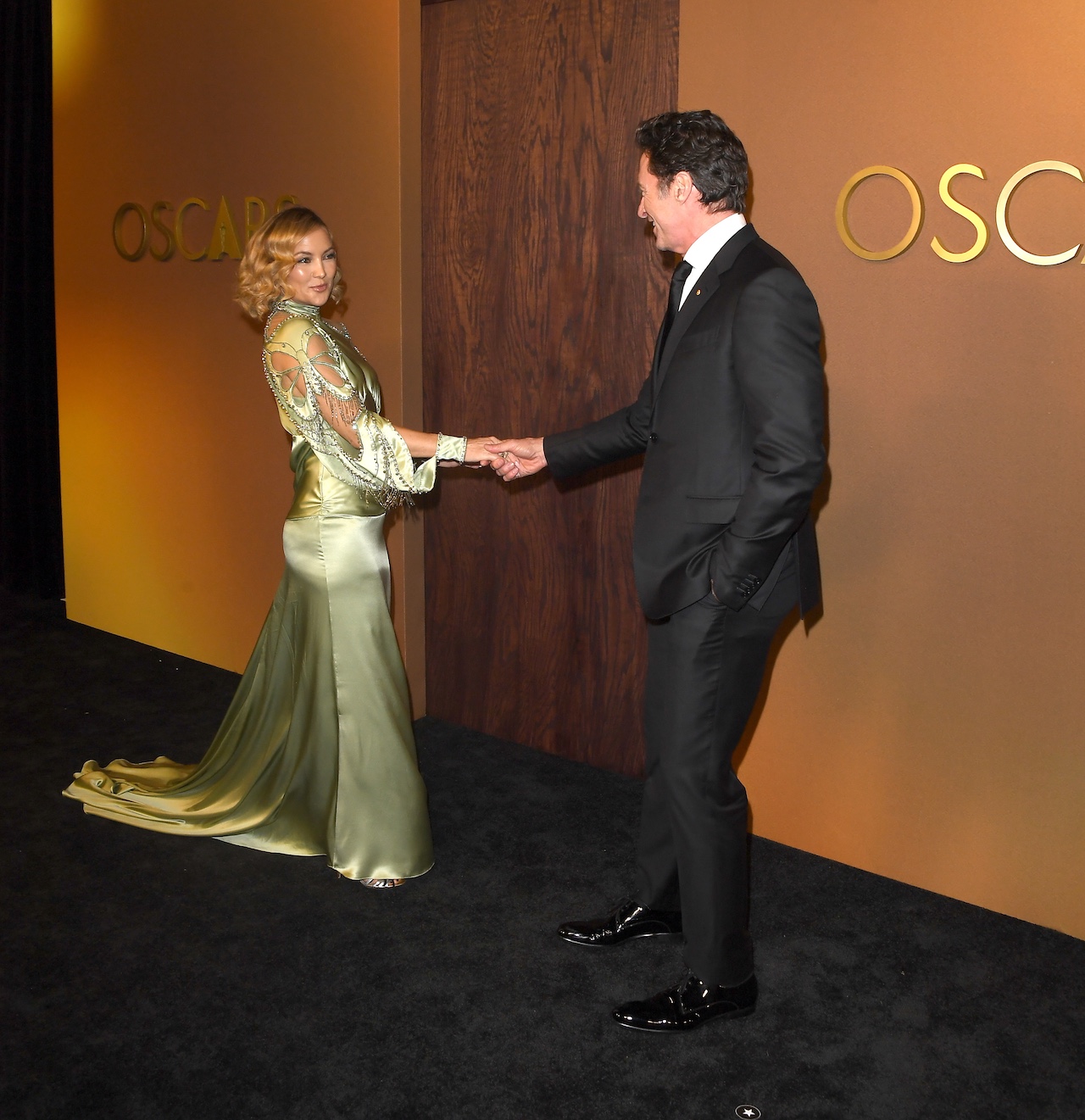 Hugh Jackman and Kate Hudson holding hands at the Governors Awards