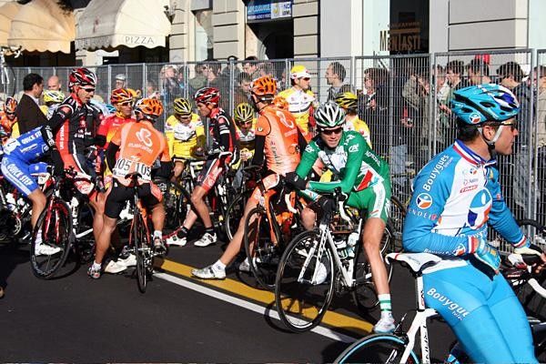 Riders enjoy the sunny side of the street on a chilly Varese morning