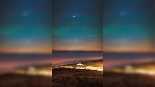 A photo of the green comet and its anti-tail above the Thy National Park in Denmark on Jan. 21.