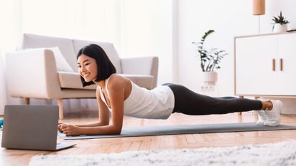 A woman doing a Pilates ab workout