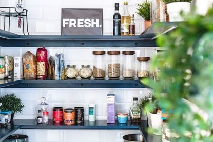 Pantry storage shelves with glass food jars