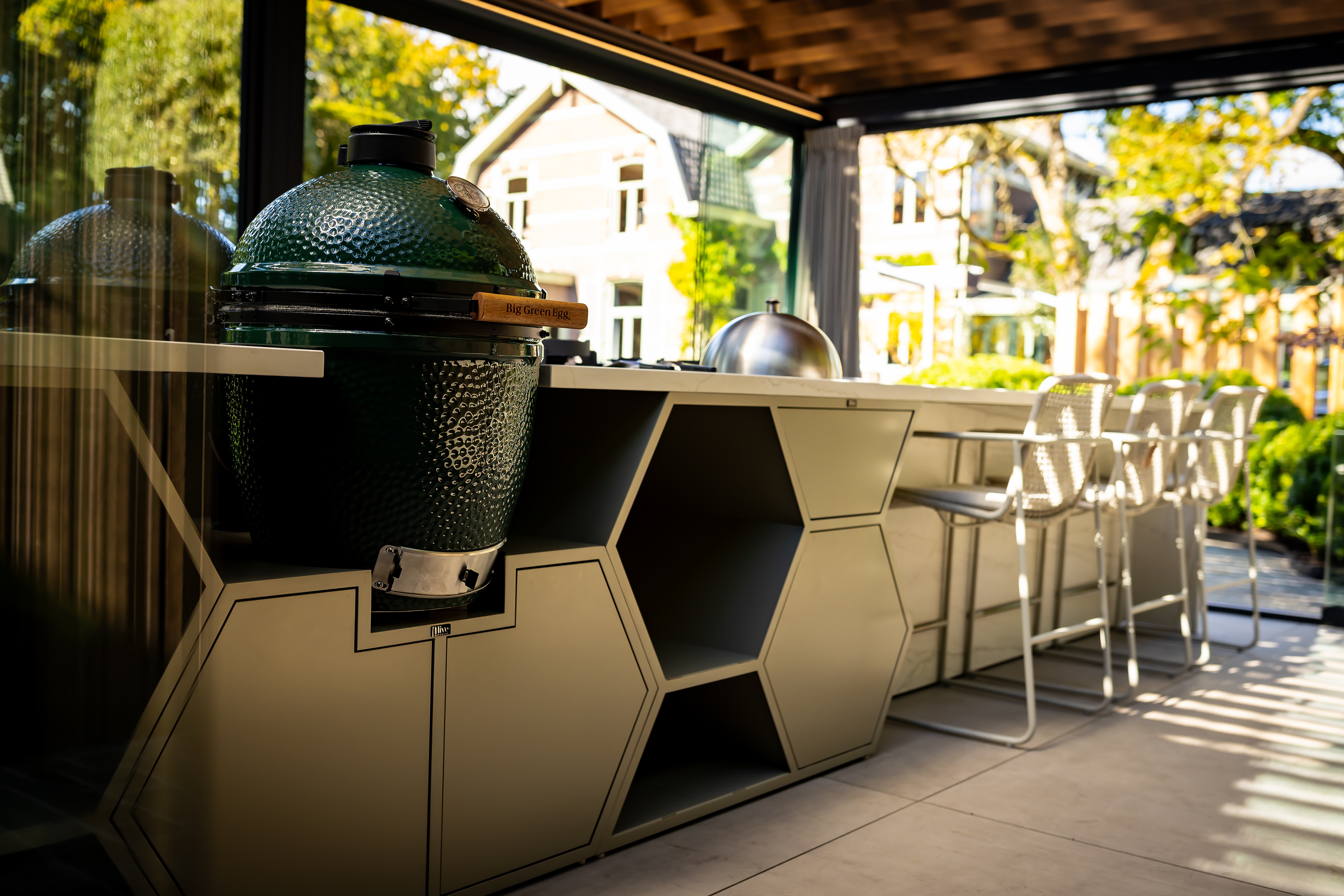 An outdoor kitchen with a statement island