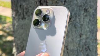 iPhone 16 Pro shown held in hand