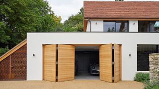 A contemporary garage with bifold garage doors