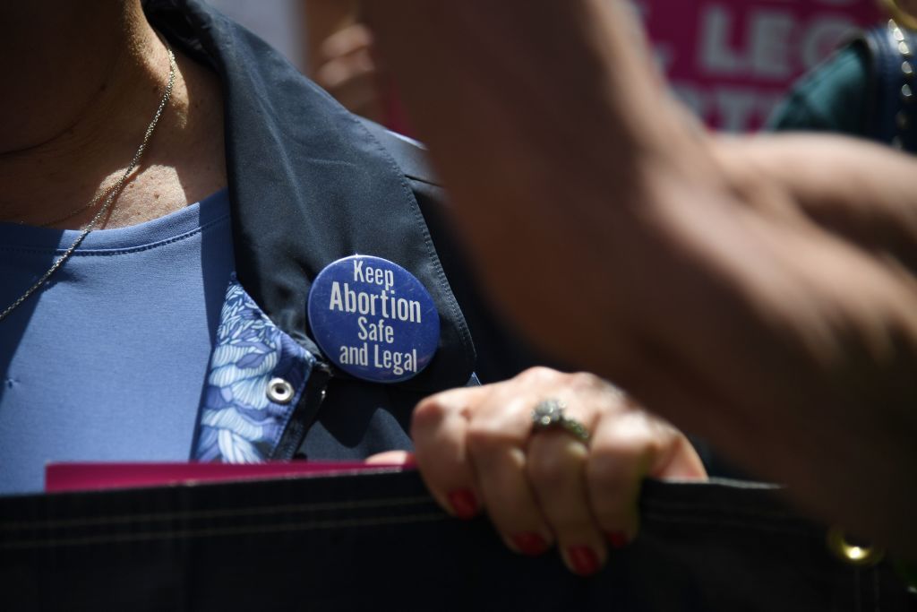 Protestor wearing pro-choice pin.