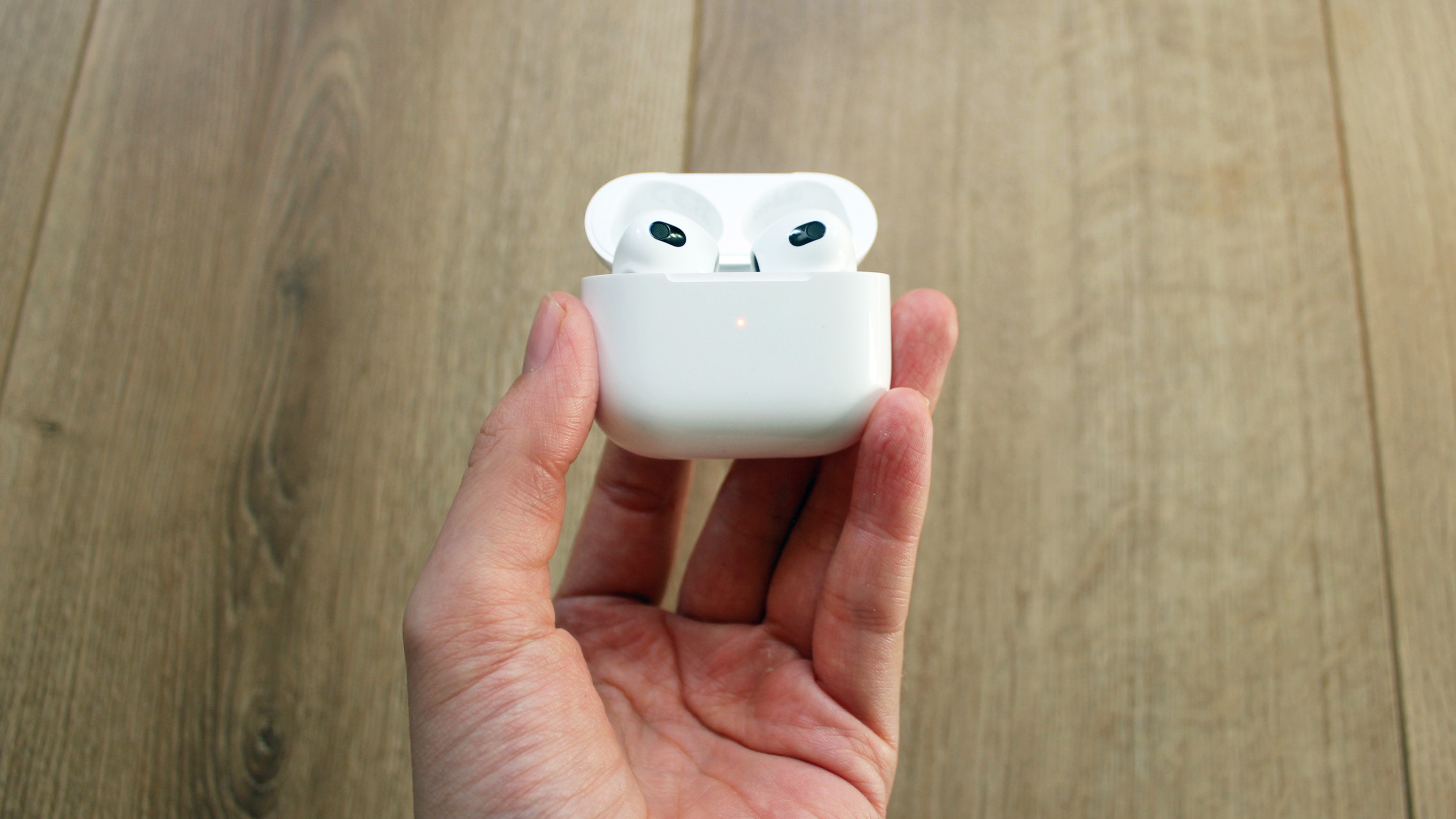 the apple airpods 3rd generation in their charging case