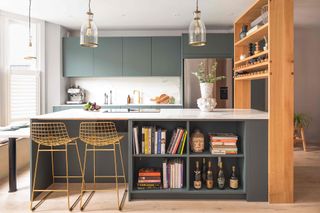 Dark green Husk Kitchen with ikea cabinets and bespoke storage