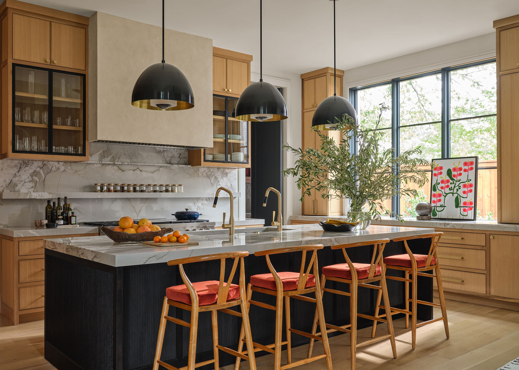 wooden kitchen with large island with marble work surface