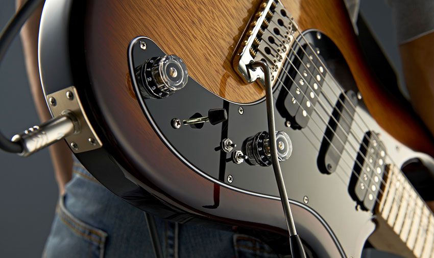 The two mini-toggles switch the two humbuckers between no-volume-drop dual and single-coil mode