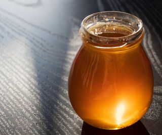 Dark amber liquid in a jar