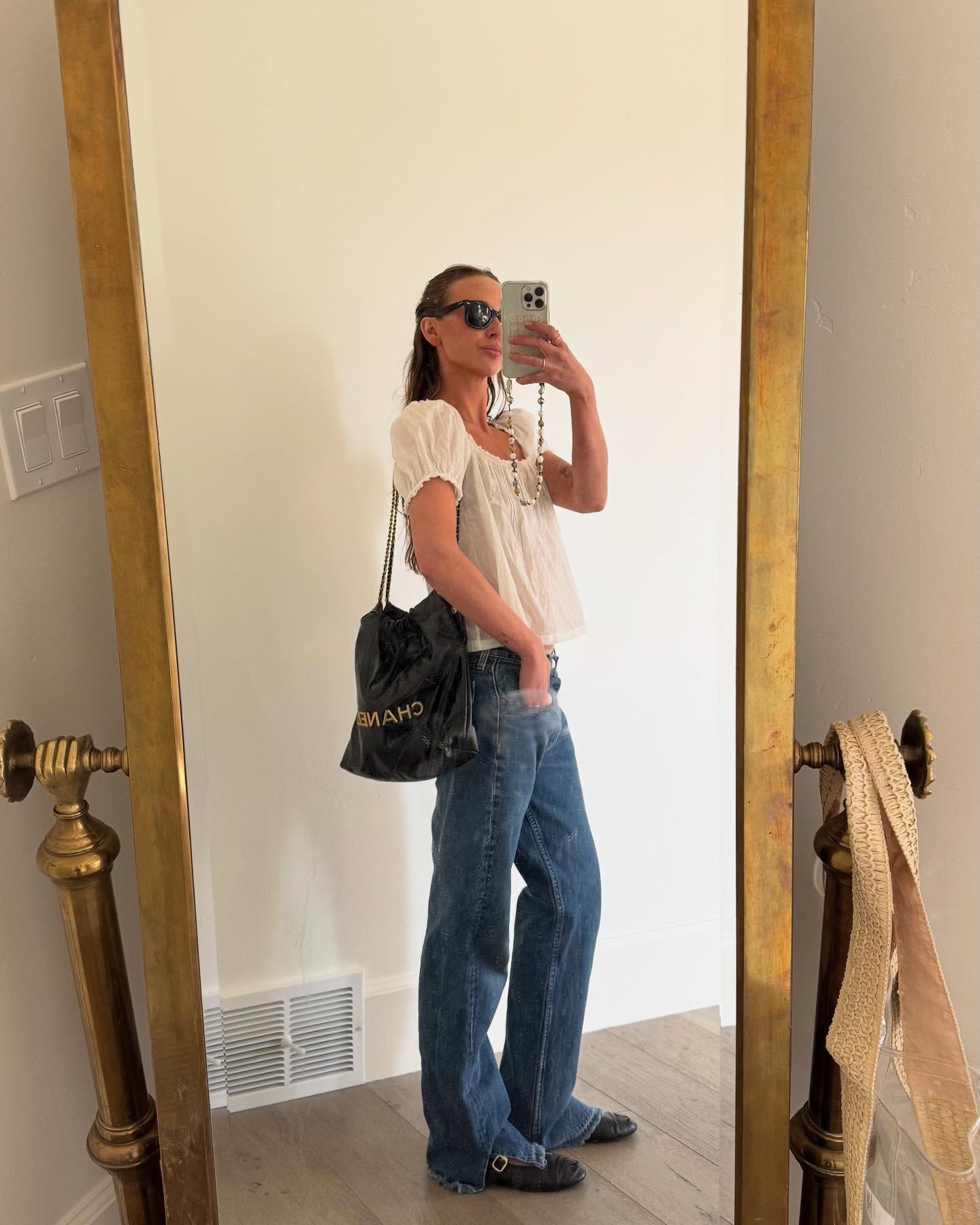 Woman in floaty Doen top and jeans