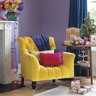 purple living room with yellow armchair