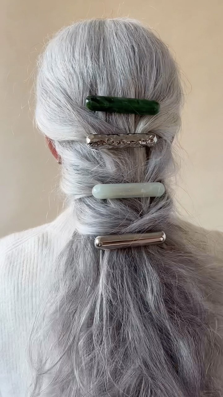 Photo of a woman wearing oversized barrettes