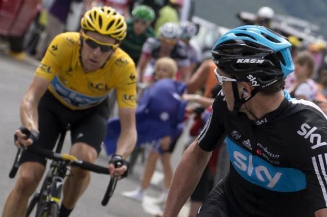 Chris Froome checks on Sky teammate and Tour leader Bradley Wiggins as the pair approach the finish of the 17th stage