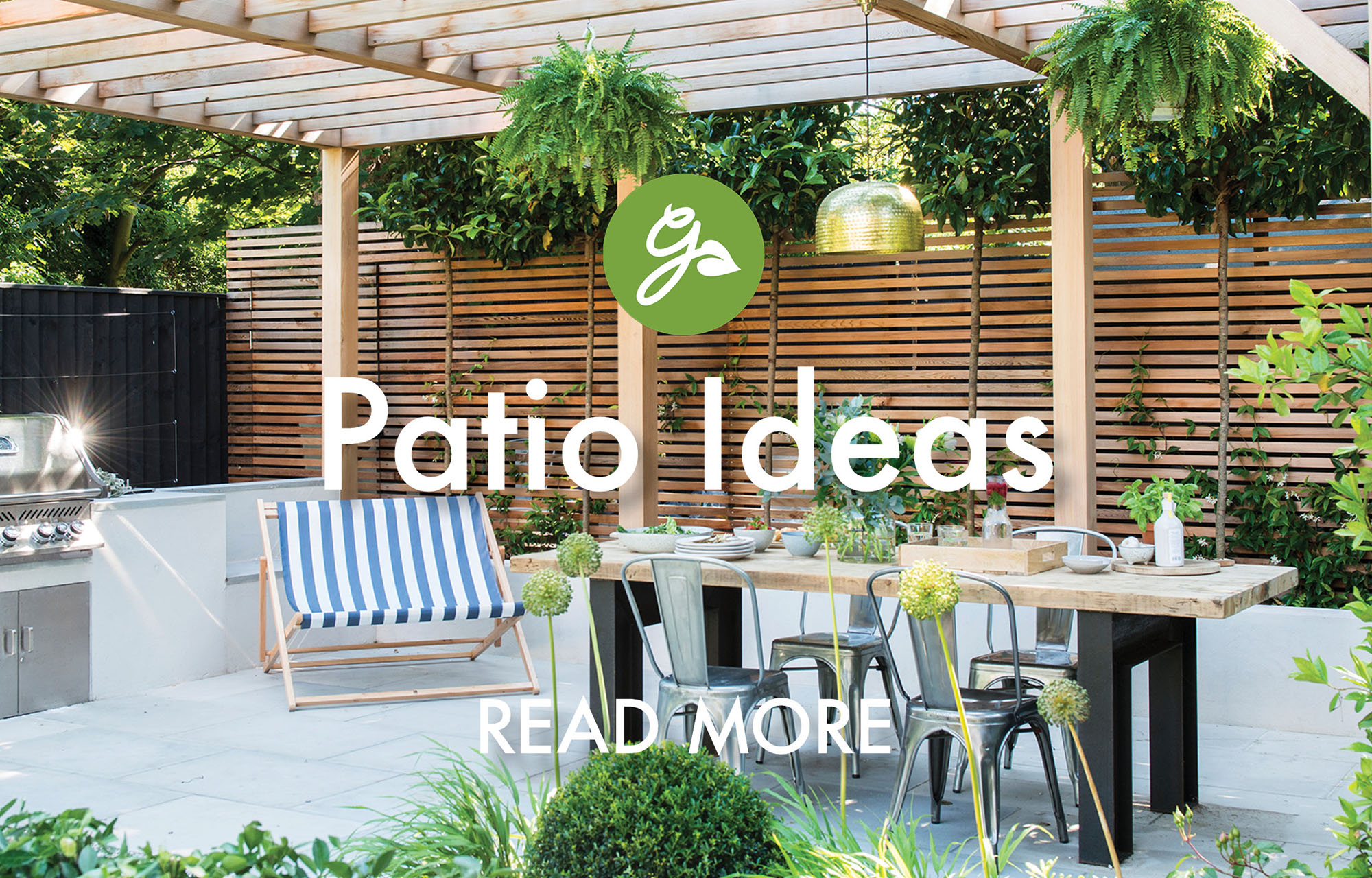 Read more about patio ideas. Image shows patio next to wooden slatted fence under pergola, with grill and modern outdoor dining table and chairs
