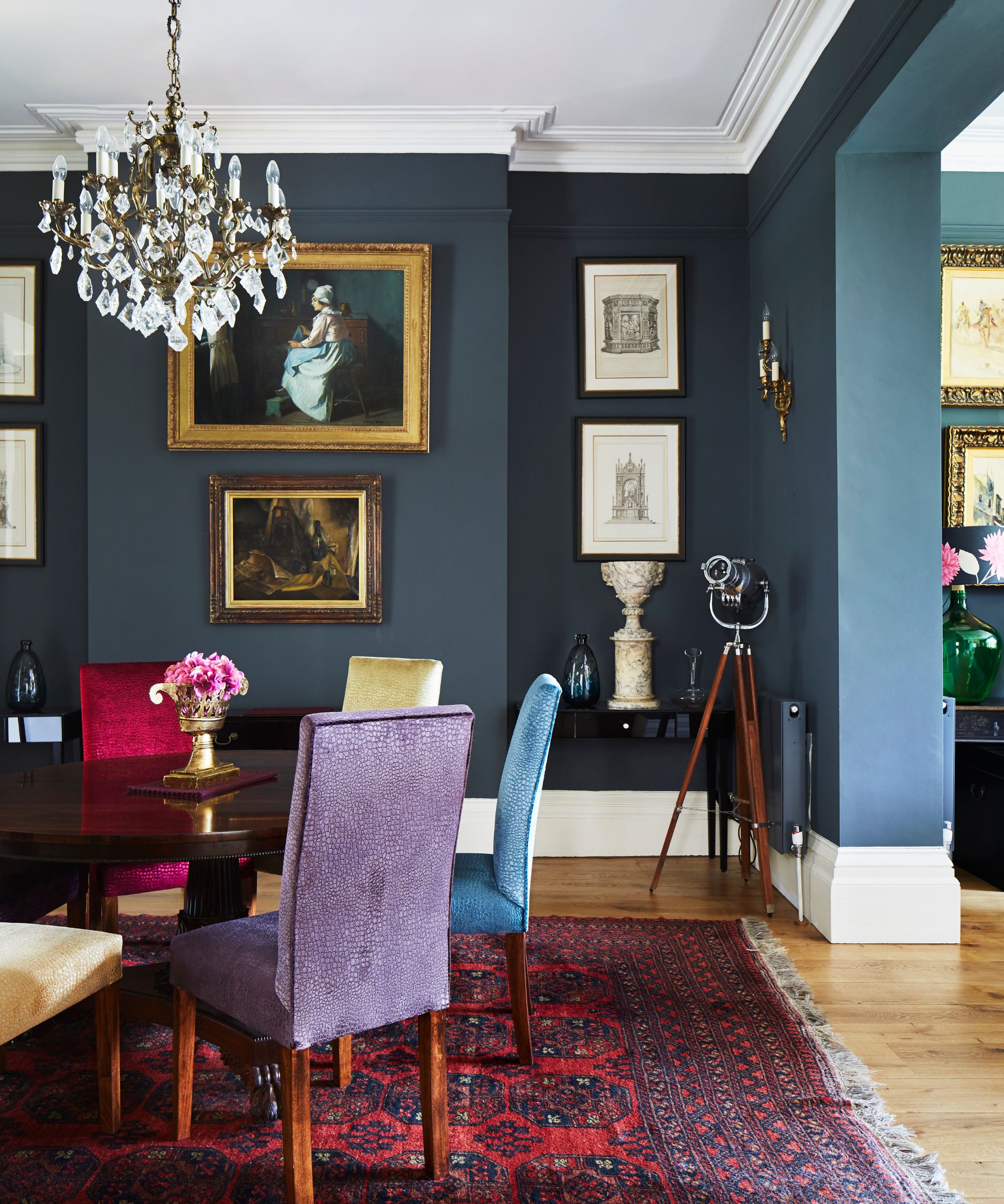 Brightly colored traditional dining room with chandelier