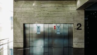 a set of three lifts in an office building