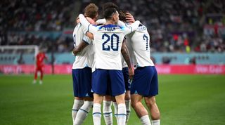 England players celebrate during the 6-2 win against Iran