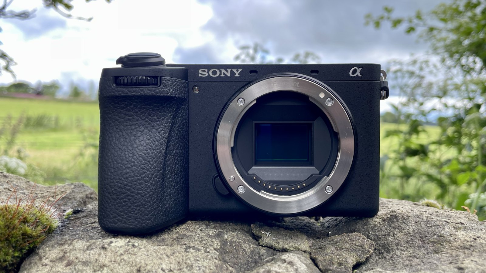 Sony Alpha A6700 mirrorless camera outside on a wall
