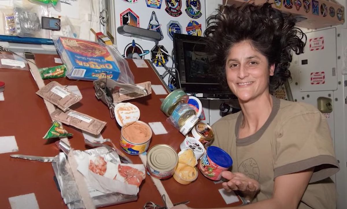 NASA astronaut Suni Williams in the ISS kitchen.