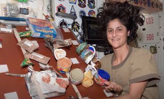 NASA astronaut Suni Williams in the ISS kitchen.