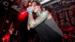 Mitch Lucker of Suicide Silence performing onstage in 2009