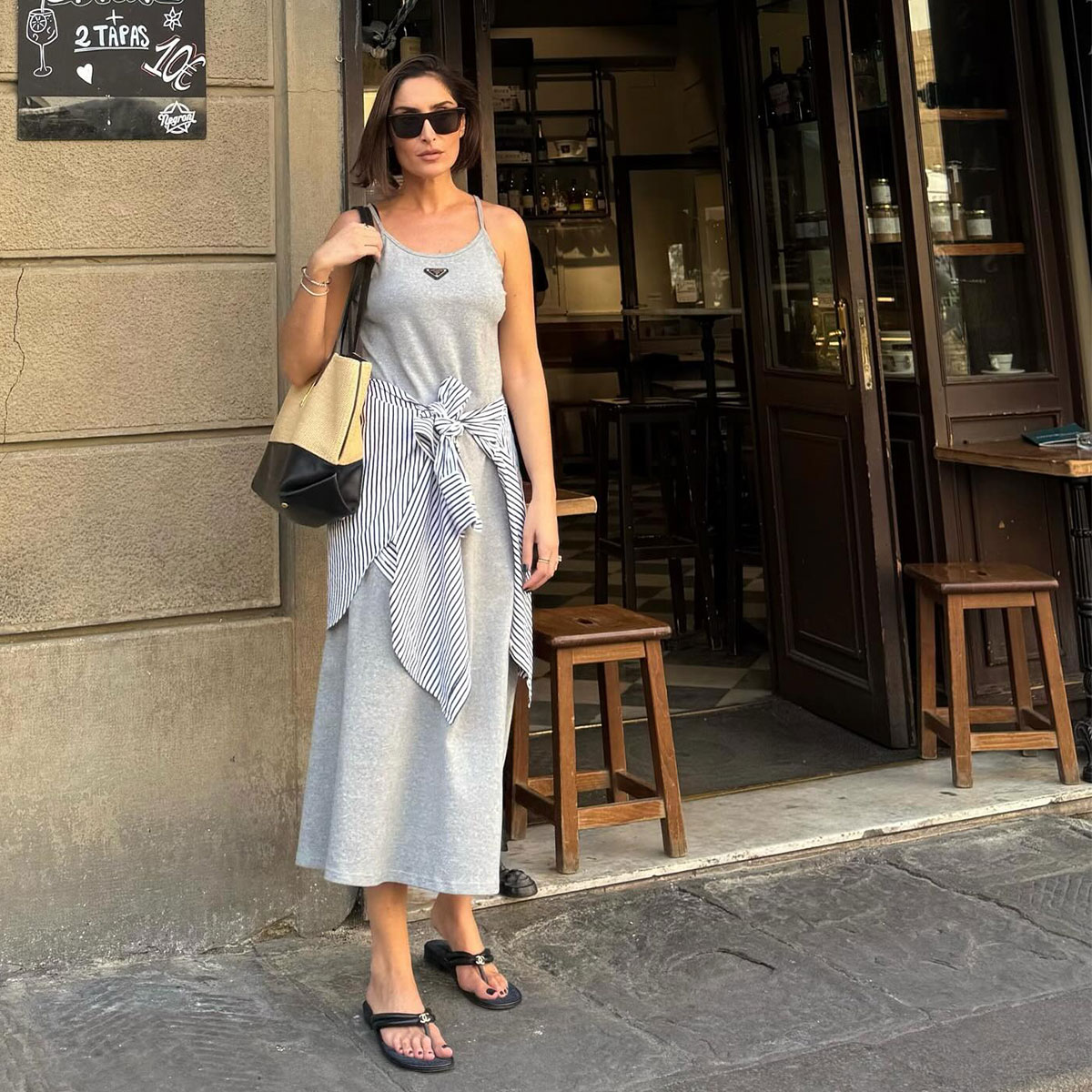 @erinoffduty in grey prada midi tank dress with black chanel flip flops and button down shirt around waist