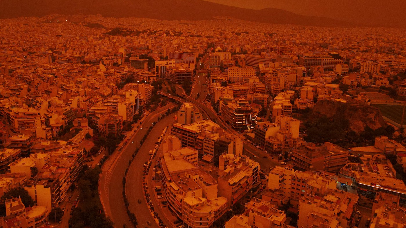 Dust blown from the Sahara desert covers the city of Athens, Greece, in an orange haze