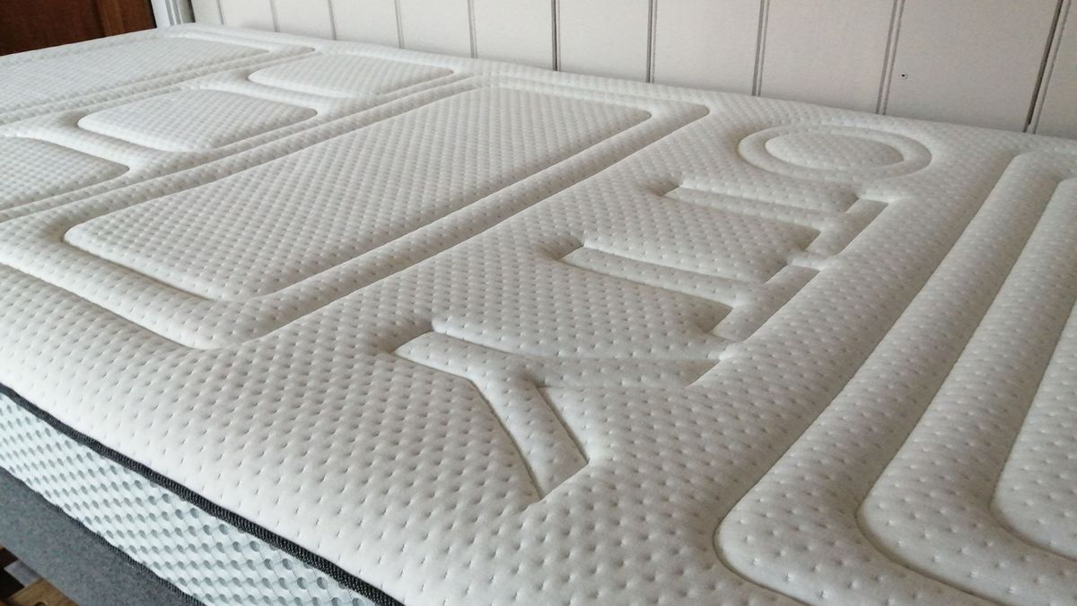 Close up of Otty Pure mattress cover, with &#039;Otty&#039; embossed logo