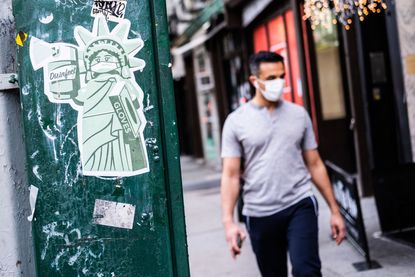 A sticker of the statue of Liberty wearing a mask is seen on May 10, 2020 in the Manhattan