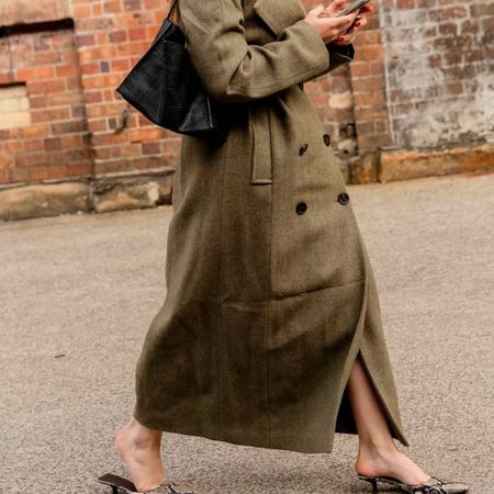 Who What Wear UK's SEO Writer, Ava Gilchrist, wearing a cashmere coat during fashion week.