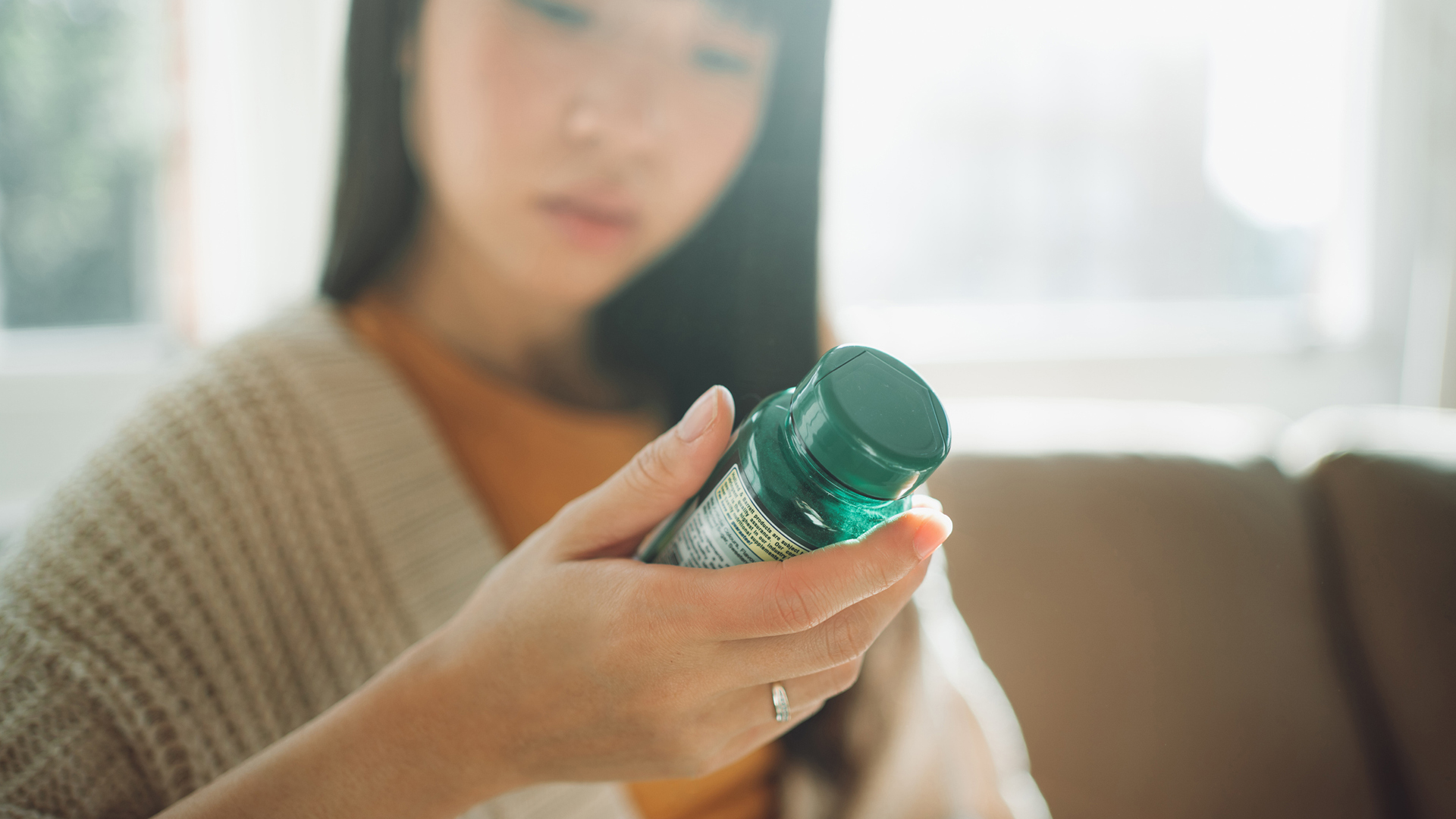 woman looking at supplements