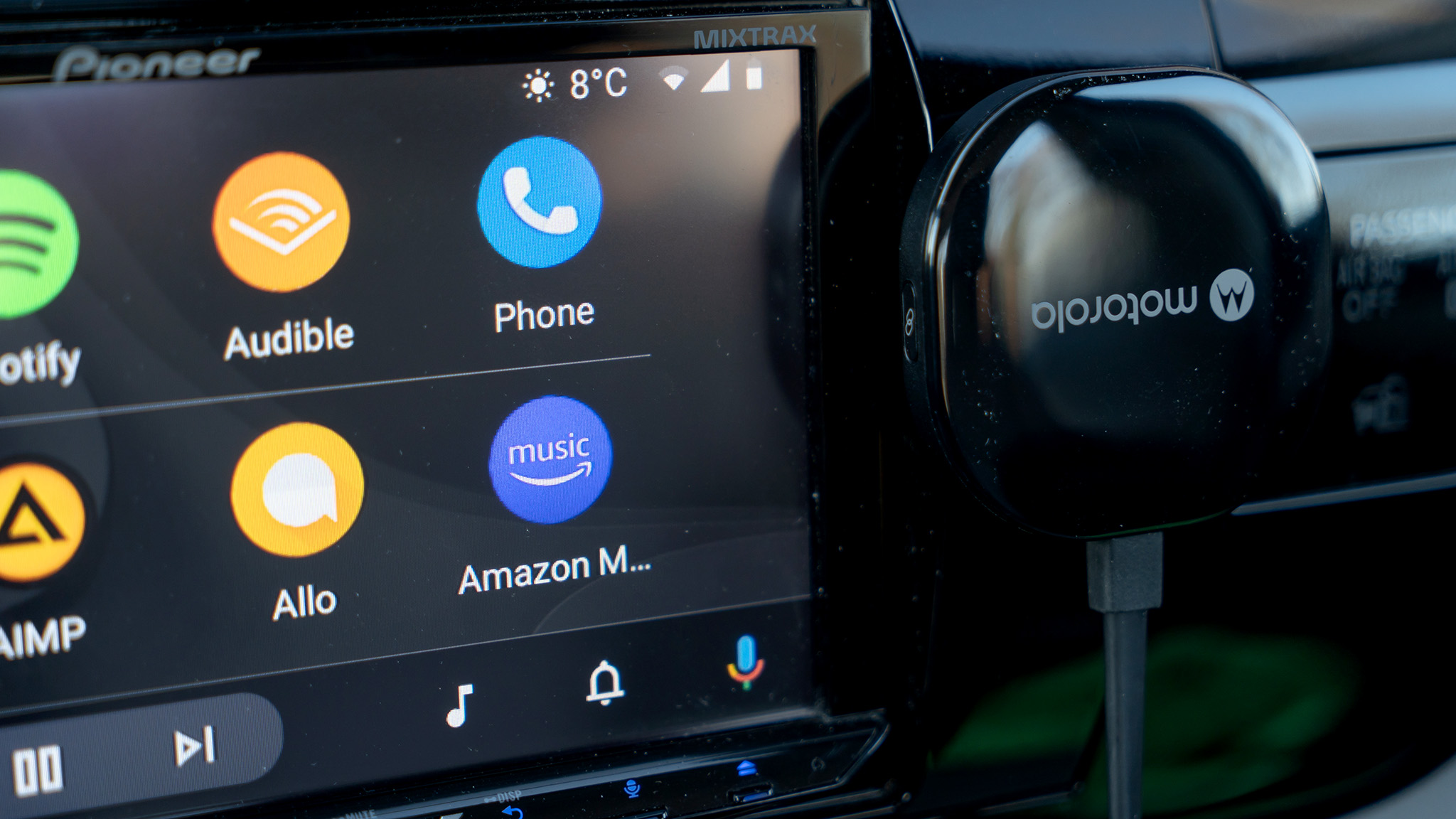 Motorola MA1 phone next to the Android Auto screen.