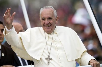 Pope Francis waves in Ecuador.
