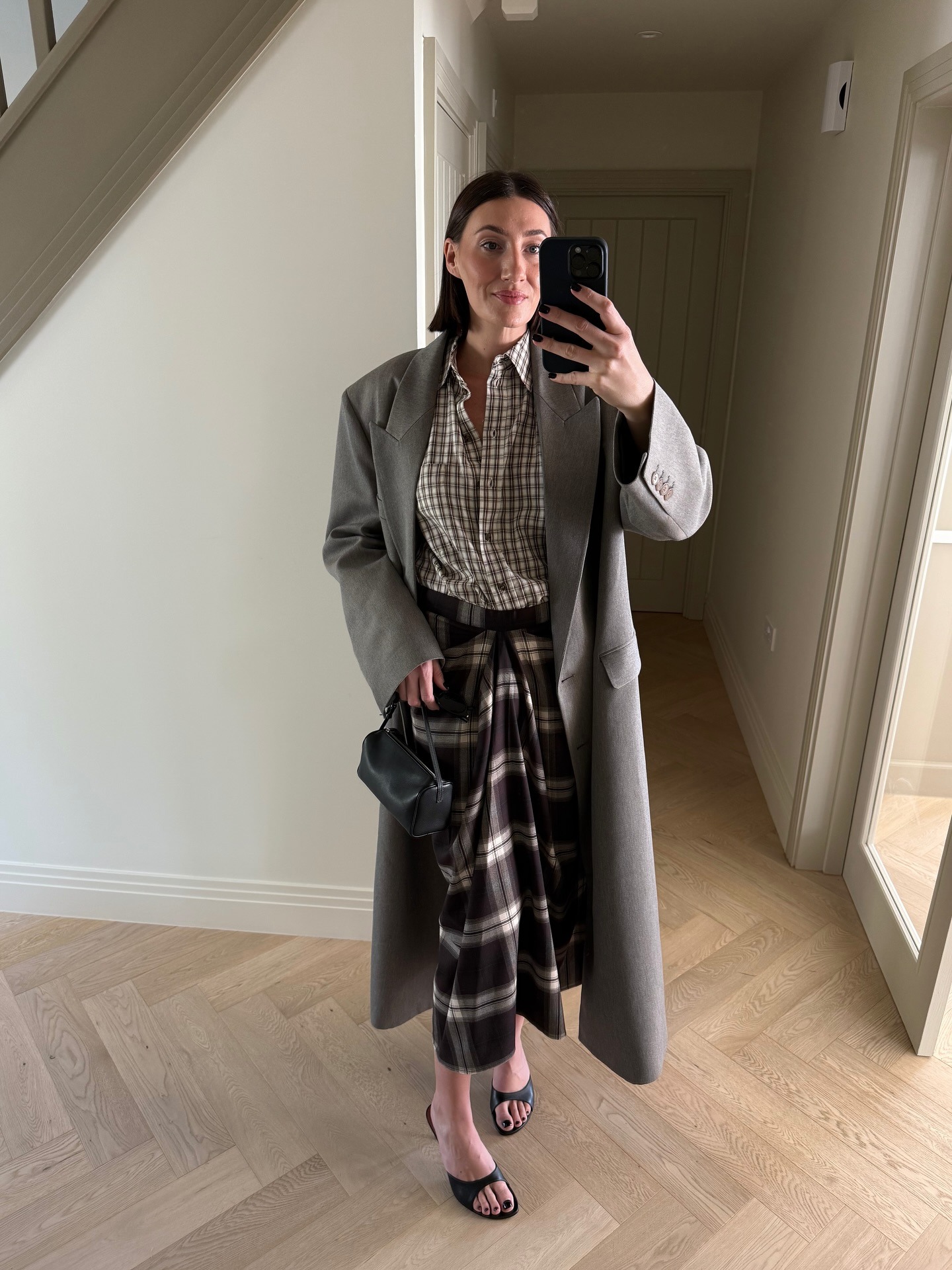 Photo of influencer wearing checkered plaid maxi skirt.